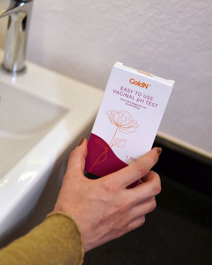 GoldN pH test box beside a bathroom sink