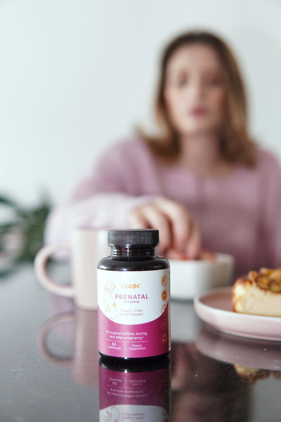 GoldN Prenatal with CoQ10 bottle on a breakfast table